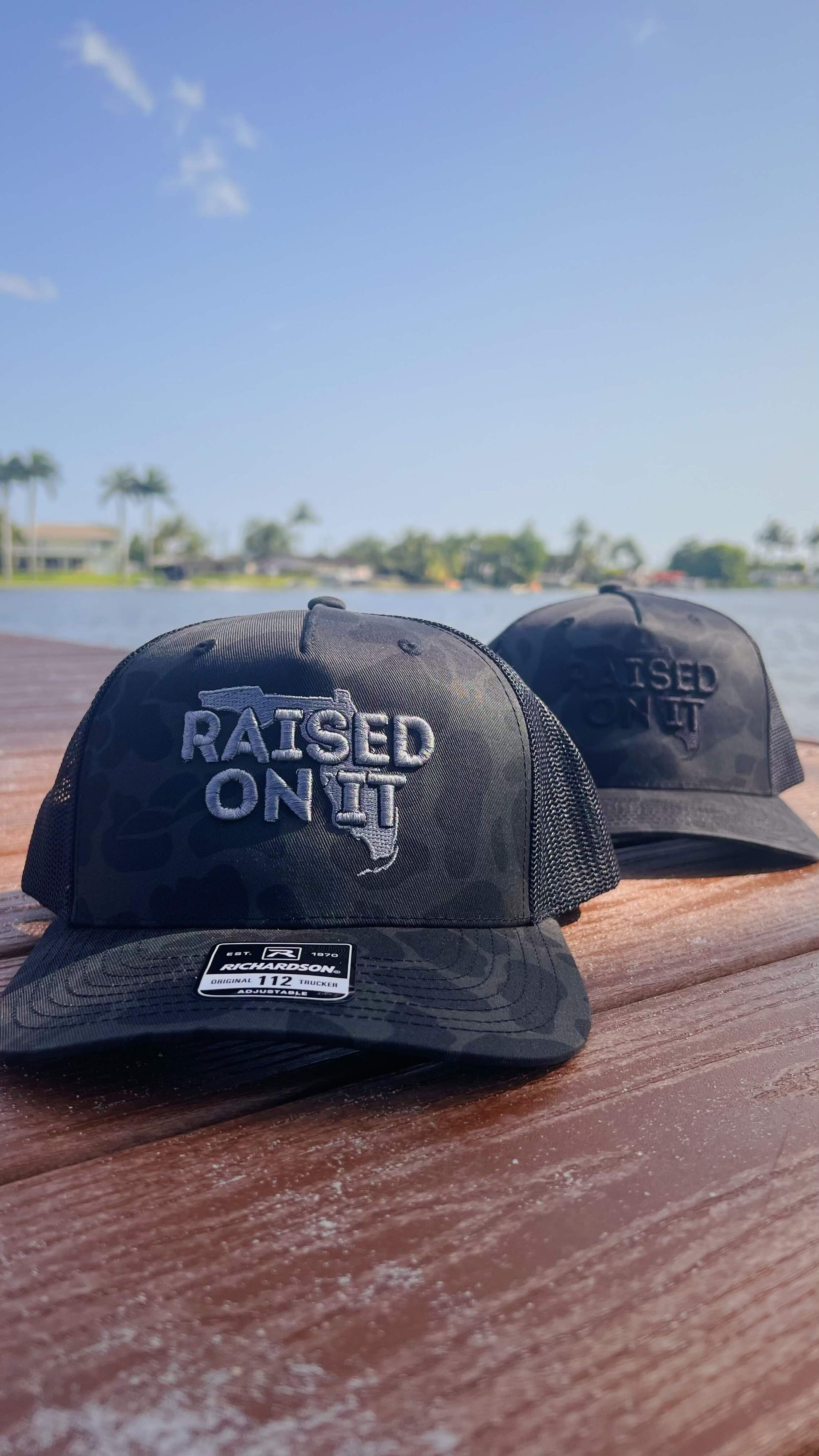Raised On It | Florida Logo | Embroidered Trucker Hat